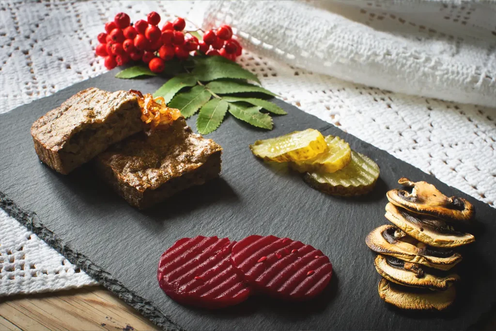 A slate board with a variety of snacks on it for storstuu.